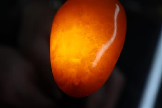 An amber pebble pendant, gross weight 22grams, 59mm.